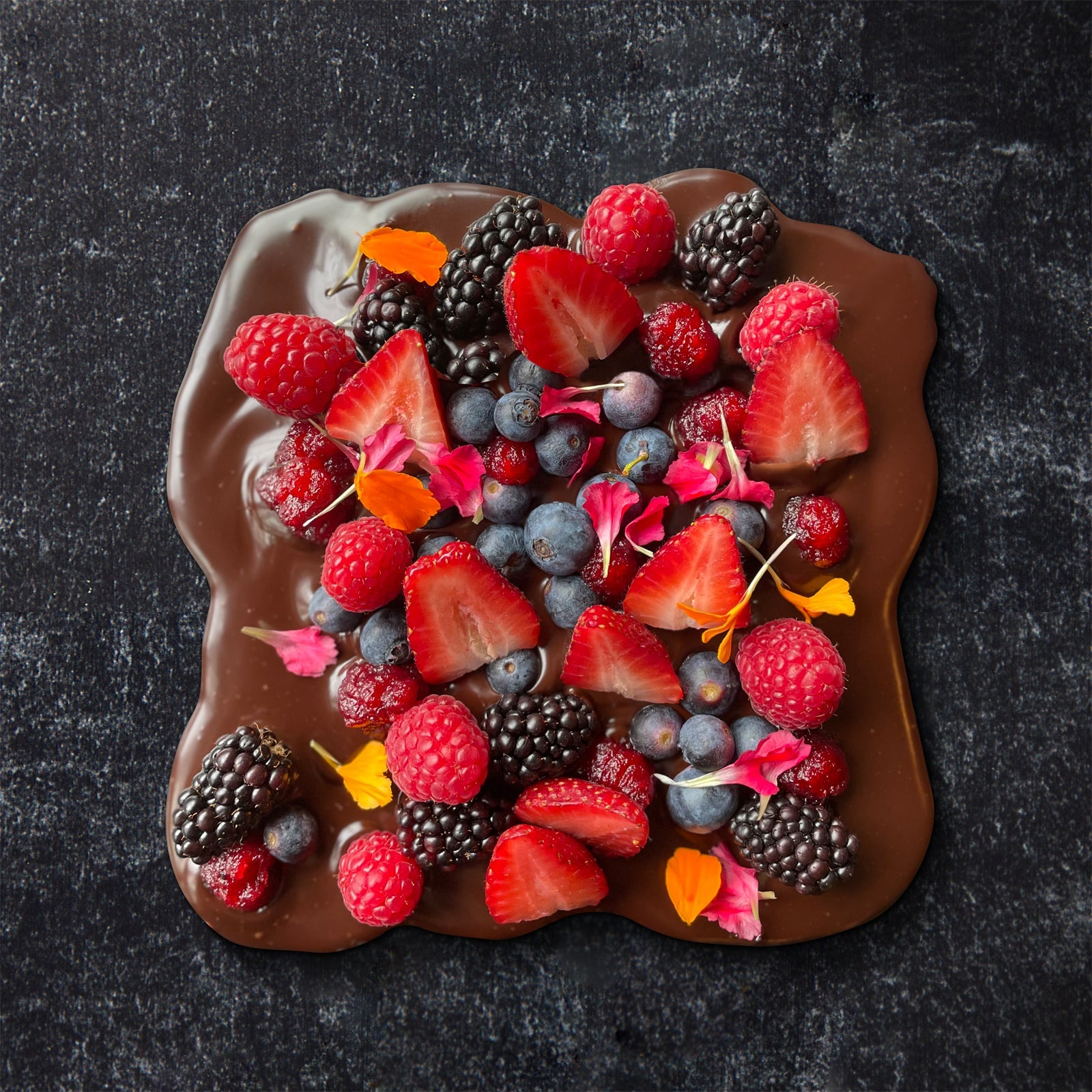 Dark Chocolate topped with fresh strawberries, blackberries, blueberries and raspberries