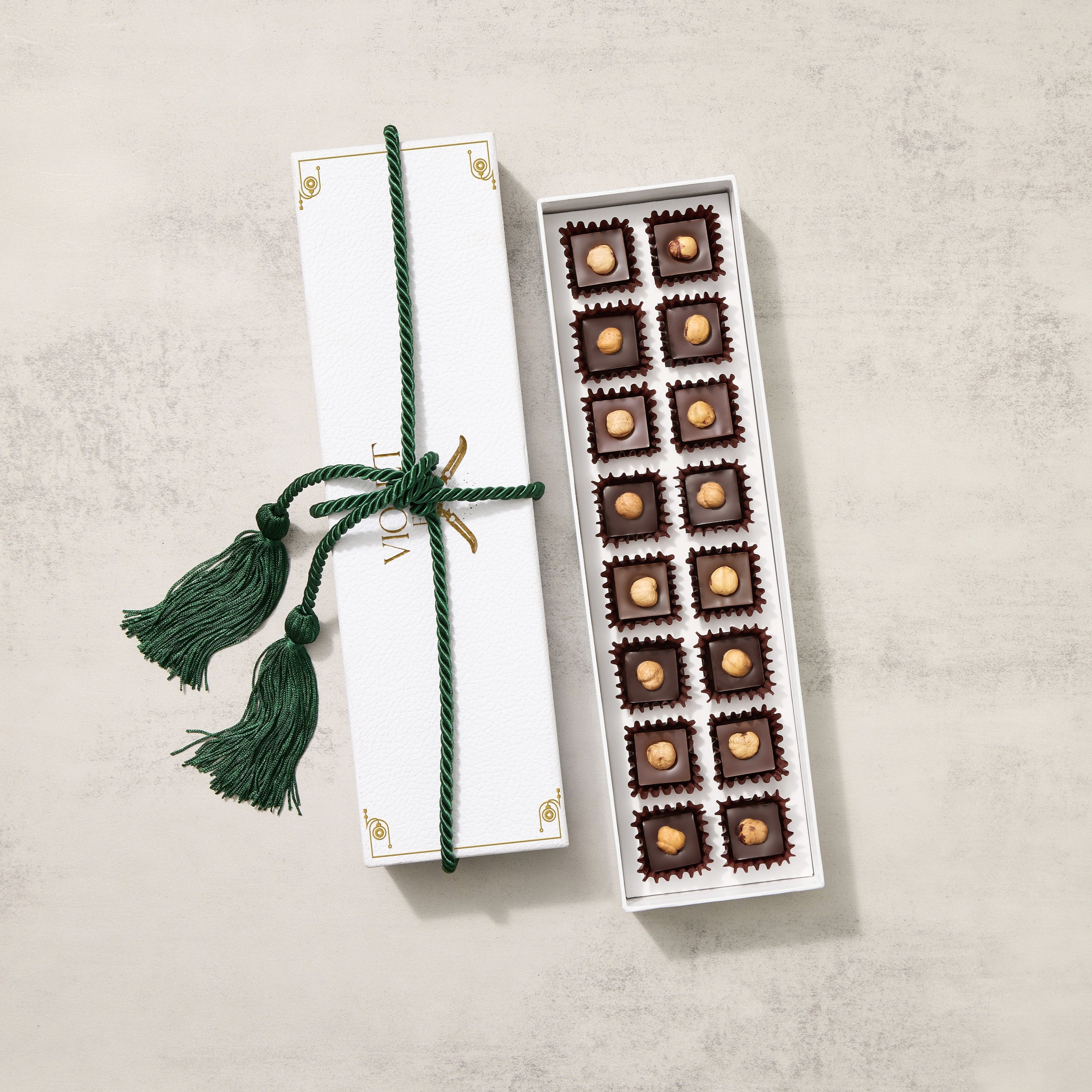 Gianduia Chocolate Truffles 16 piece Gift Set including dark chocolate truffles with hazelnut on top.