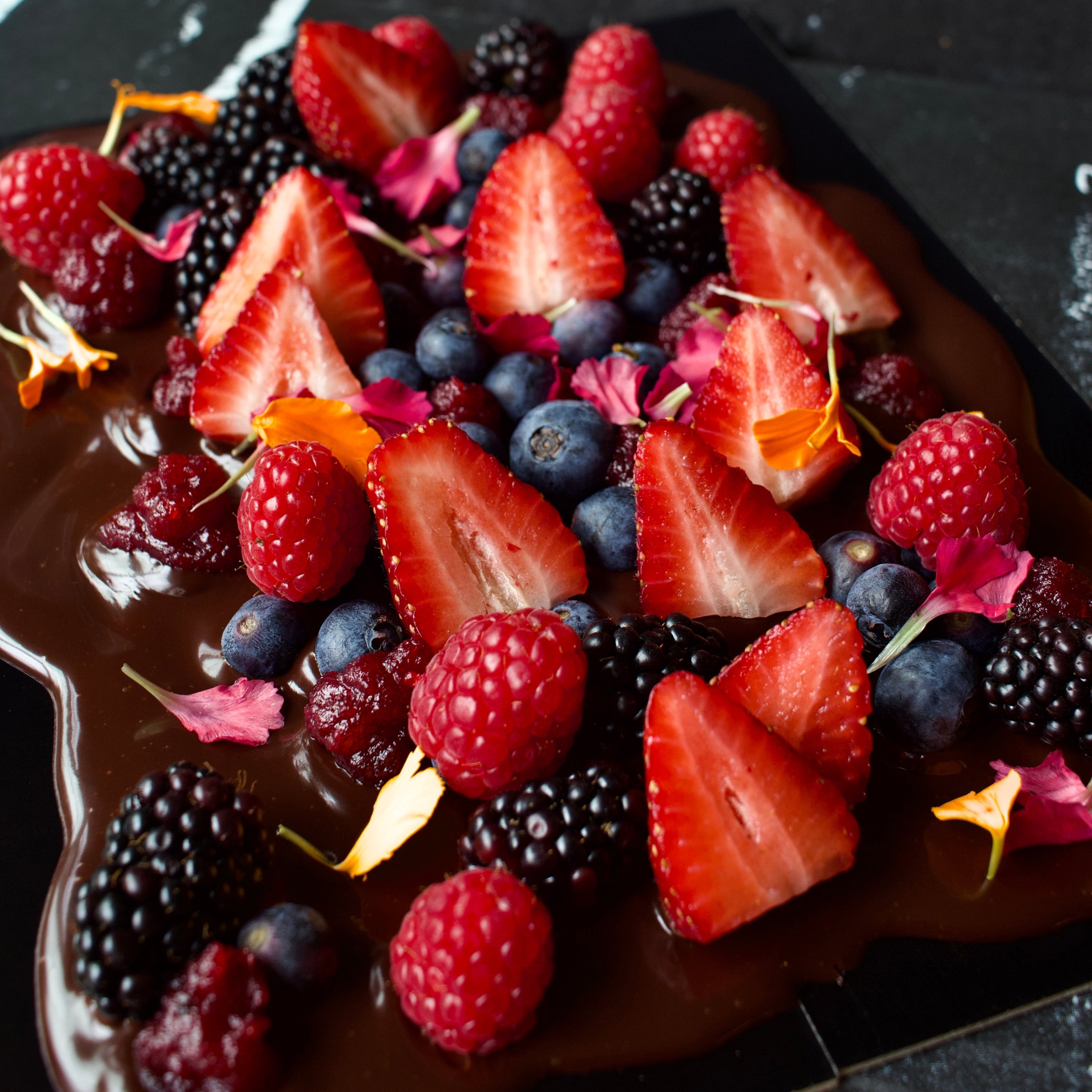 Dark chocolate with fresh raspberries, strawberries, blackberries and blueberries