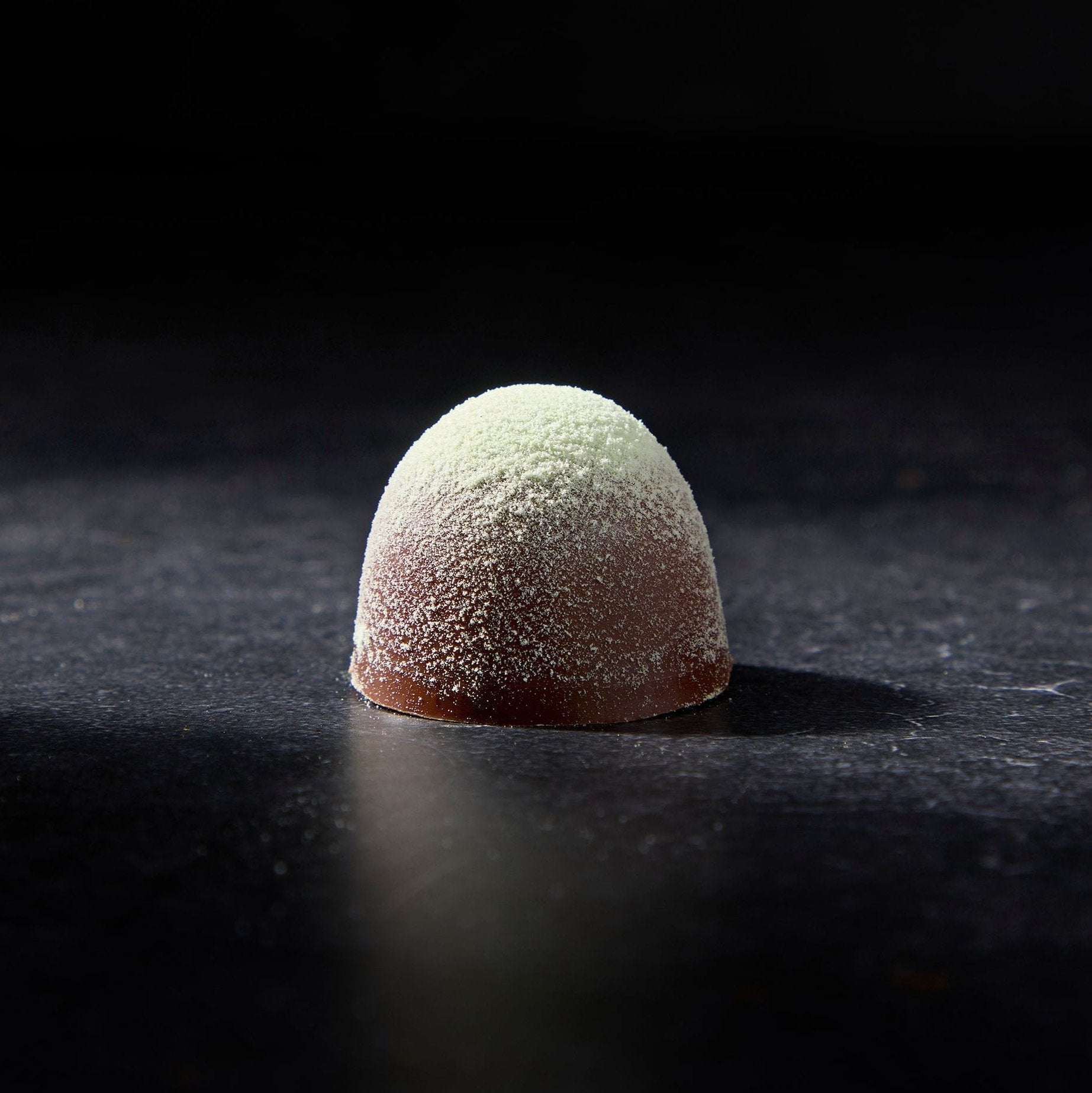 Milk Chocolate Truffle with ceremonial matcha, Peruvian cacao, banana, and wild-grazed milk.