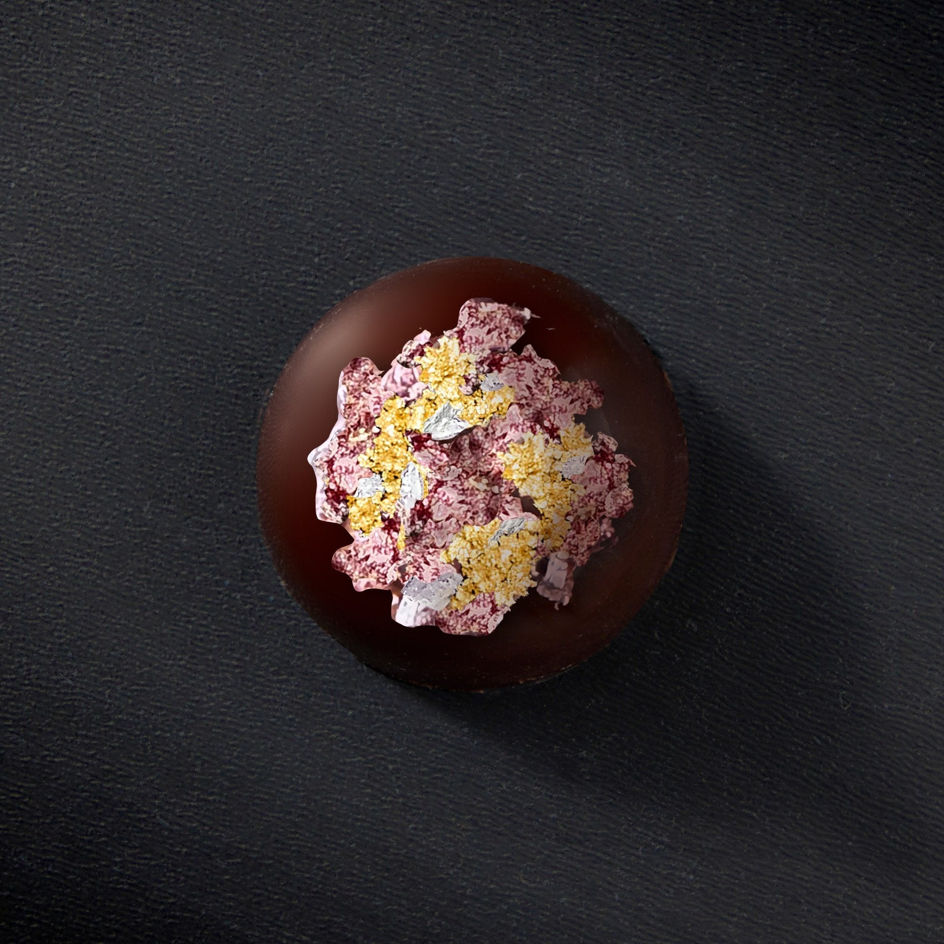 An overhead view of a Dark Chocolate Truffle blended with coconut puree and topped with 24 Kt gold