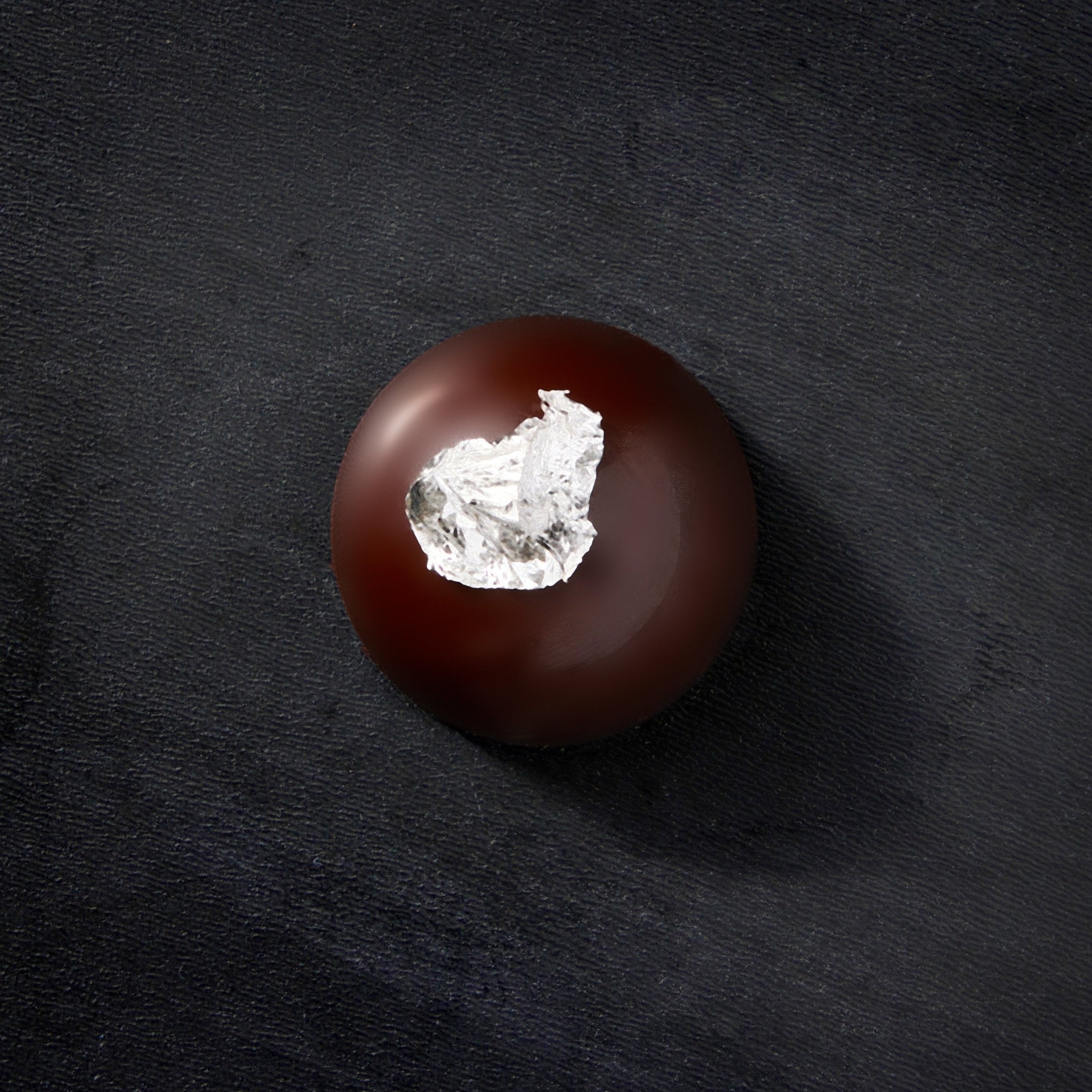 Dark Chocolate Truffle with a silver leaf on top