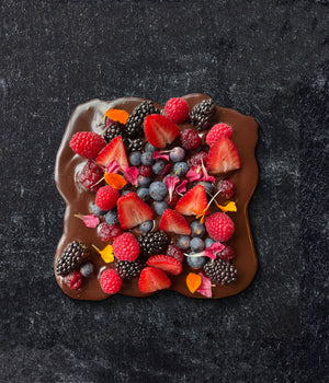 a chocolate covered fruit with berries