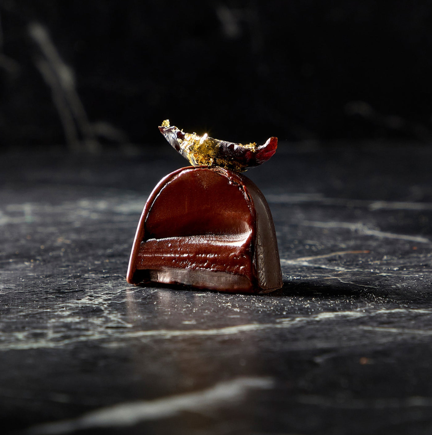 a chocolate candy with a leaf on top